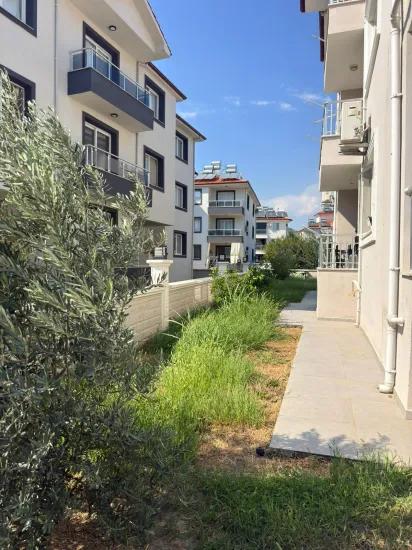 Nahe dem Zentrum von Ortaca 2+1 möbliert Wohnung zu verkaufen.