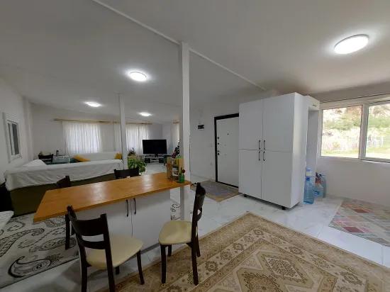 в Muğla Dalyan 1.000 m2 зарегистрированная земля, и 150 m2 2+1 деревенский дом на продажу, с квартирой из Ortaca.